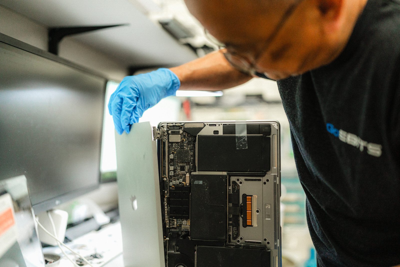 bellevue based computer repair shop repaing a macbook for digital marketing